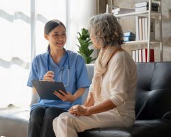 home-healthcare-nurse-physical-therapy-with-senior-adult-woman-at-home-1